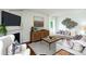 Cozy living room with a fireplace, comfortable seating, and large windows for natural light at 227 Paige Rd, Kings Mountain, NC 28086