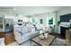 Open-concept living space with modern kitchen, fireplace, and ample natural light at 227 Paige Rd, Kings Mountain, NC 28086