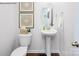 Stylish powder room with a pedestal sink, elegant fixtures, and decorative accents offers a convenient and attractive space at 227 Paige Rd, Kings Mountain, NC 28086