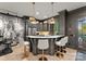 Elegant bar area with custom cabinetry, stone countertops, pendant lighting, and comfortable seating at 2288 Brawley School Rd, Mooresville, NC 28117