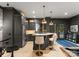 Stylish bar area featuring custom cabinetry, granite countertops, pendant lighting, and comfortable seating at 2288 Brawley School Rd, Mooresville, NC 28117