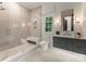 Bright bathroom with a walk-in shower, sleek vanity, and elegant fixtures for a luxurious experience at 2288 Brawley School Rd, Mooresville, NC 28117