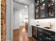 View of kitchen, featuring modern cabinets, marble counters, and a wine fridge at 2288 Brawley School Rd, Mooresville, NC 28117