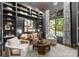 Cozy living room features custom built-in shelving, comfortable seating, and plenty of natural light at 2288 Brawley School Rd, Mooresville, NC 28117