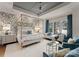 Stunning main bedroom boasts four-poster bed, sitting area, and decorative wall at 2288 Brawley School Rd, Mooresville, NC 28117