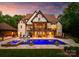 Elegant home featuring a sparkling pool, spa, and spacious patio for entertaining at 2288 Brawley School Rd, Mooresville, NC 28117