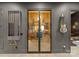 A well-organized wine cellar behind glass doors, with room for pool sticks, a guitar, and an adjacent powder room at 2288 Brawley School Rd, Mooresville, NC 28117