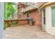 View of the wooden back deck with grill, overlooking the home's brick exterior at 2330 Raven Dr, Rock Hill, SC 29732