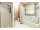 Well-lit bathroom with a shower, bathtub, toilet, and ample space at 2330 Raven Dr, Rock Hill, SC 29732