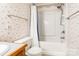 Cozy bathroom with a tub/shower, patterned wallpaper, and a modern toilet at 2330 Raven Dr, Rock Hill, SC 29732