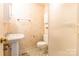 Cozy bathroom featuring a pedestal sink, toilet, and a shower with frosted glass door at 2330 Raven Dr, Rock Hill, SC 29732