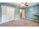 Bedroom featuring a large closet with doors, neutral carpet, and a ceiling fan at 2330 Raven Dr, Rock Hill, SC 29732