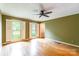 Spacious bedroom featuring hardwood floors, white trim and plentiful natural light at 2330 Raven Dr, Rock Hill, SC 29732