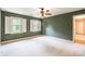 Comfortable bedroom with two windows, shutters, ceiling fan, and green walls at 2330 Raven Dr, Rock Hill, SC 29732