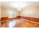 Dining room featuring hardwood floors, a chandelier, and natural light from one window at 2330 Raven Dr, Rock Hill, SC 29732