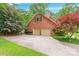 Brick garage and home exterior surrounded by a lush green yard at 2330 Raven Dr, Rock Hill, SC 29732