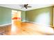 Open-concept living area with hardwood floors, a ceiling fan, and a view into an adjacent room, offering ample space at 2330 Raven Dr, Rock Hill, SC 29732