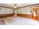 Bright living room with a brick fireplace, wood accents, and a ceiling fan, offering a comfortable living space at 2330 Raven Dr, Rock Hill, SC 29732