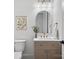 Modern powder room featuring elegant fixtures, marble countertops, and a stylish arched mirror at 2370 Bridgewater Rd, Rock Hill, SC 29730