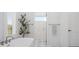 Bright bathroom featuring a soaking tub, glass shower, and marble floors at 2370 Bridgewater Rd, Rock Hill, SC 29730