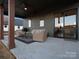 Covered patio has a ceiling fan and outdoor seating area with a sliding glass door at 2370 Bridgewater Rd, Rock Hill, SC 29730