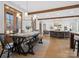 Elegant dining area and living space featuring a rustic wooden table, modern lighting, and abundant natural light at 2370 Bridgewater Rd, Rock Hill, SC 29730