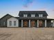 Inviting home featuring a stone facade, covered entryway, and large front yard at 2370 Bridgewater Rd, Rock Hill, SC 29730
