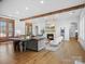Open-concept living room featuring a stone fireplace and hardwood floors at 2370 Bridgewater Rd, Rock Hill, SC 29730