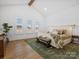 Spacious main bedroom with hardwood floors, vaulted ceilings, and large windows providing ample natural light at 2370 Bridgewater Rd, Rock Hill, SC 29730