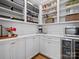 Walk-in pantry with white cabinets, quartz countertops, stainless steel microwave, and a beverage cooler at 2370 Bridgewater Rd, Rock Hill, SC 29730