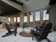 Covered patio with outdoor seating and a modern fire pit to enjoy those cool evenings at 2370 Bridgewater Rd, Rock Hill, SC 29730