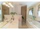 Spacious bathroom features a double vanity, a soaking tub, decorative mirrors, and a separate glass-enclosed shower at 3008 Imperial Dr, Gastonia, NC 28054
