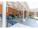 Inviting covered patio with cozy seating, perfect for outdoor relaxation and enjoying the serene surroundings at 3008 Imperial Dr, Gastonia, NC 28054