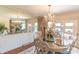 Bright dining room with a chandelier, a large mirror, and views to the outdoor brick patio at 3008 Imperial Dr, Gastonia, NC 28054