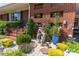 Cozy front porch area with intricate brickwork and custom landscaping details at 3008 Imperial Dr, Gastonia, NC 28054