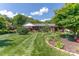 Charming single-story home with meticulously landscaped front yard, lush lawn, and colorful flowerbeds at 3008 Imperial Dr, Gastonia, NC 28054