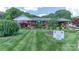 Charming brick home with beautifully landscaped front yard and manicured lawn at 3008 Imperial Dr, Gastonia, NC 28054
