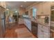 Eat-in kitchen with stainless steel appliances, granite countertops, and hardwood floors at 3008 Imperial Dr, Gastonia, NC 28054