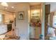 Eat-in kitchen offers stainless appliances, a glass front display cabinet, granite counters and an adjacent sunroom at 3008 Imperial Dr, Gastonia, NC 28054