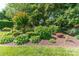 Lush landscaping featuring a variety of plants, shrubs, and vibrant flowers creating a serene outdoor space at 3008 Imperial Dr, Gastonia, NC 28054