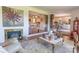 Cozy living room features a fireplace, hardwood floors, and an open floor plan perfect for entertaining at 3008 Imperial Dr, Gastonia, NC 28054