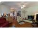 Bright living room features wood floors, fireplace, and seamless flow into the dining area and kitchen at 3008 Imperial Dr, Gastonia, NC 28054