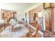 Spacious living room featuring hardwood floors, a decorative rug, and seamless transition to kitchen and dining area at 3008 Imperial Dr, Gastonia, NC 28054