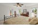 Bright bedroom with large windows, wooden dresser, and comfortable bed at 3129 Summerfield Ridge Ln, Matthews, NC 28105