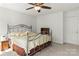 Cozy bedroom featuring a metal bed frame, ceiling fan, and neutral color palette at 3129 Summerfield Ridge Ln, Matthews, NC 28105