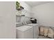 A laundry room featuring a side-by-side washer and dryer at 3129 Summerfield Ridge Ln, Matthews, NC 28105