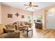 Inviting living room with hardwood floors, a large window, and comfortable seating for a warm and welcoming space at 3129 Summerfield Ridge Ln, Matthews, NC 28105