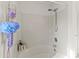 White shower and bathtub combination featuring a handheld shower head at 3129 Summerfield Ridge Ln, Matthews, NC 28105