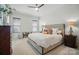 Bright bedroom with a modern bed, window blinds, ceiling fan, and stylish decor at 330 Horton Grove Rd, Fort Mill, SC 29715