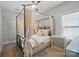Cozy bedroom with a decorative four-poster bed, curtains, and a ceiling fan at 330 Horton Grove Rd, Fort Mill, SC 29715